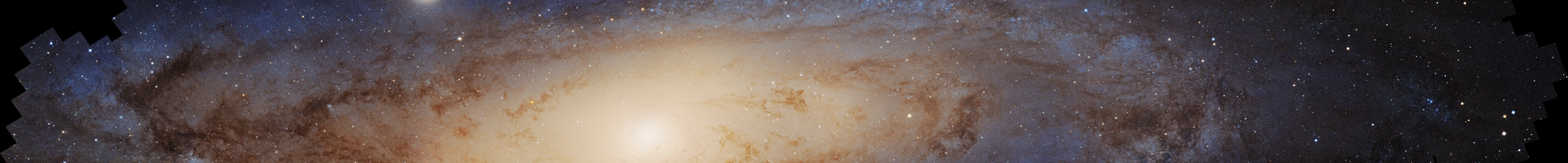 A long strip of the Andromeda galaxy from Hubble's gigapixel mosaic: the bright core, dust lanes, and millions of individual stars, with stair-stepped mosaic edges.
