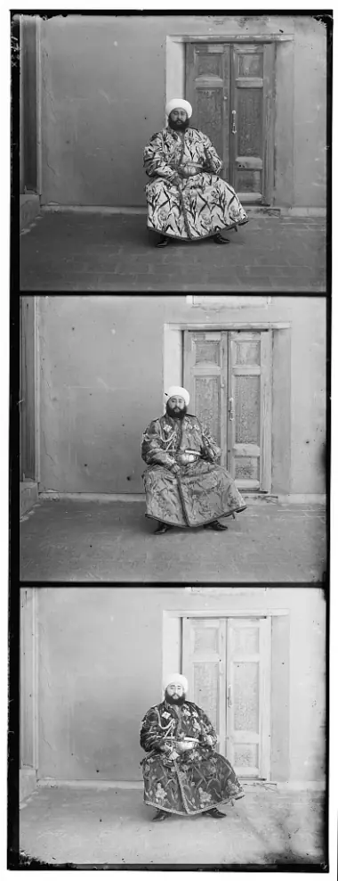 The raw glass plate: three vertical black-and-white frames of the same Emir, one per color filter.