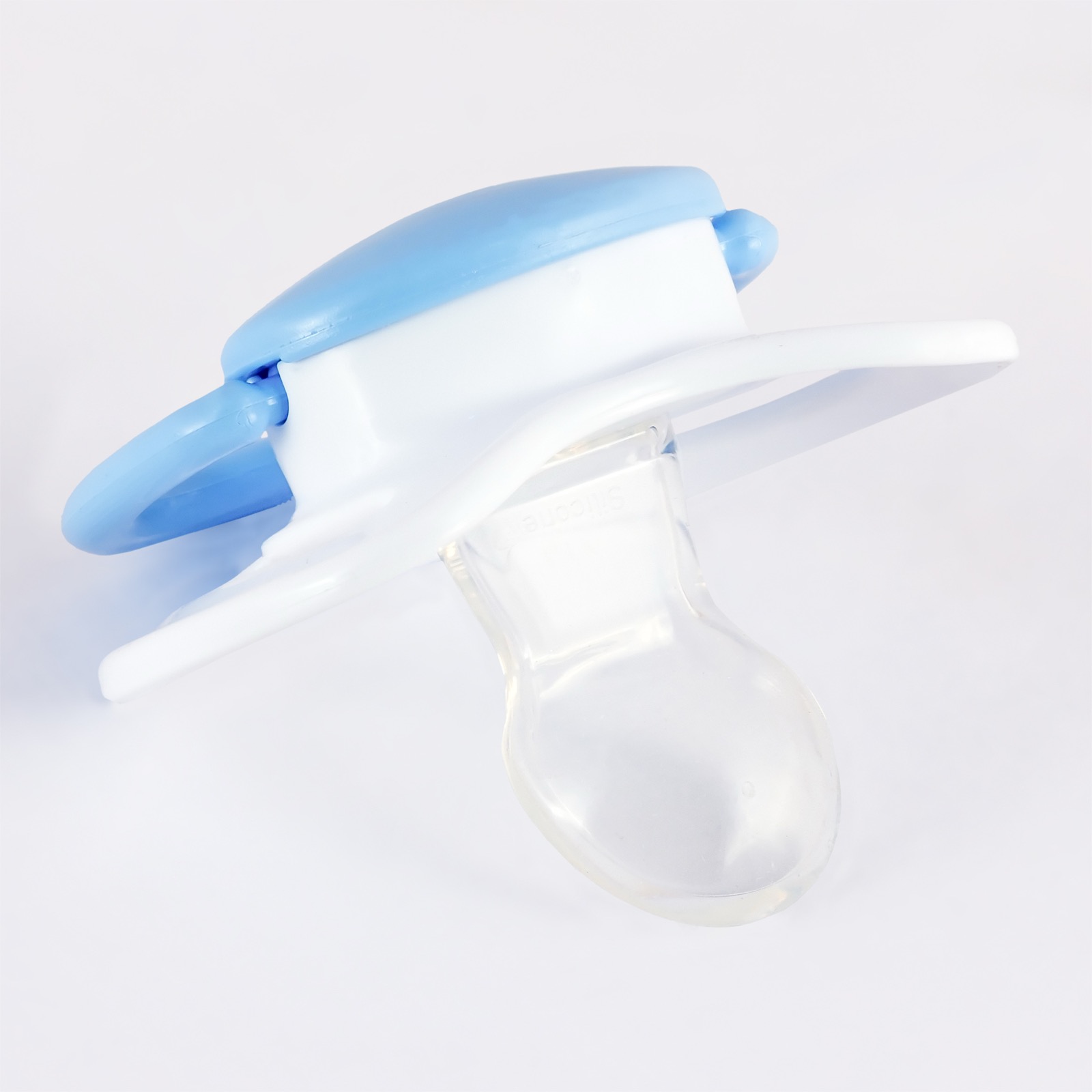 A single newborn pacifier on a plain white background.