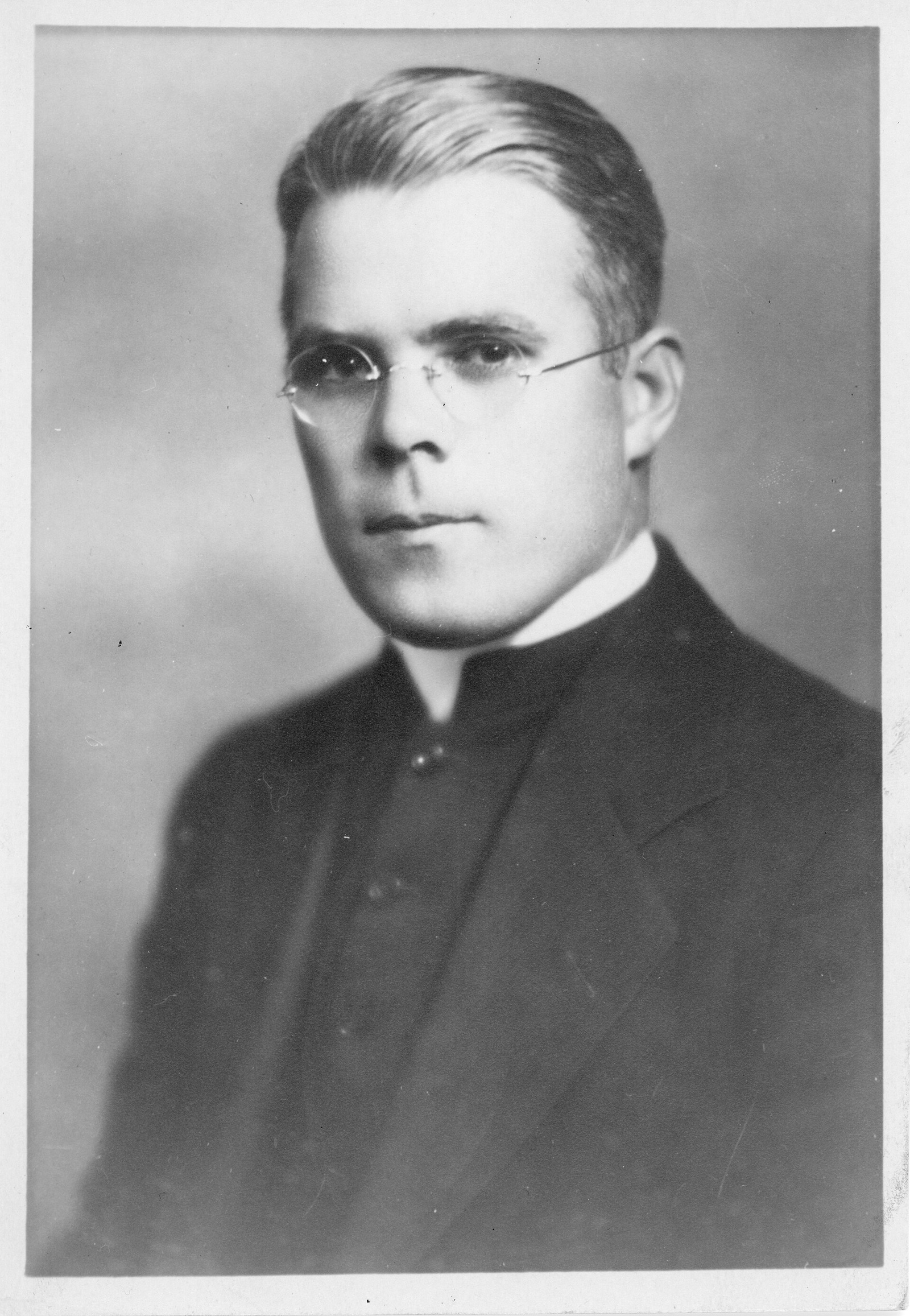 A young Father Ed Dowling in a Roman collar.