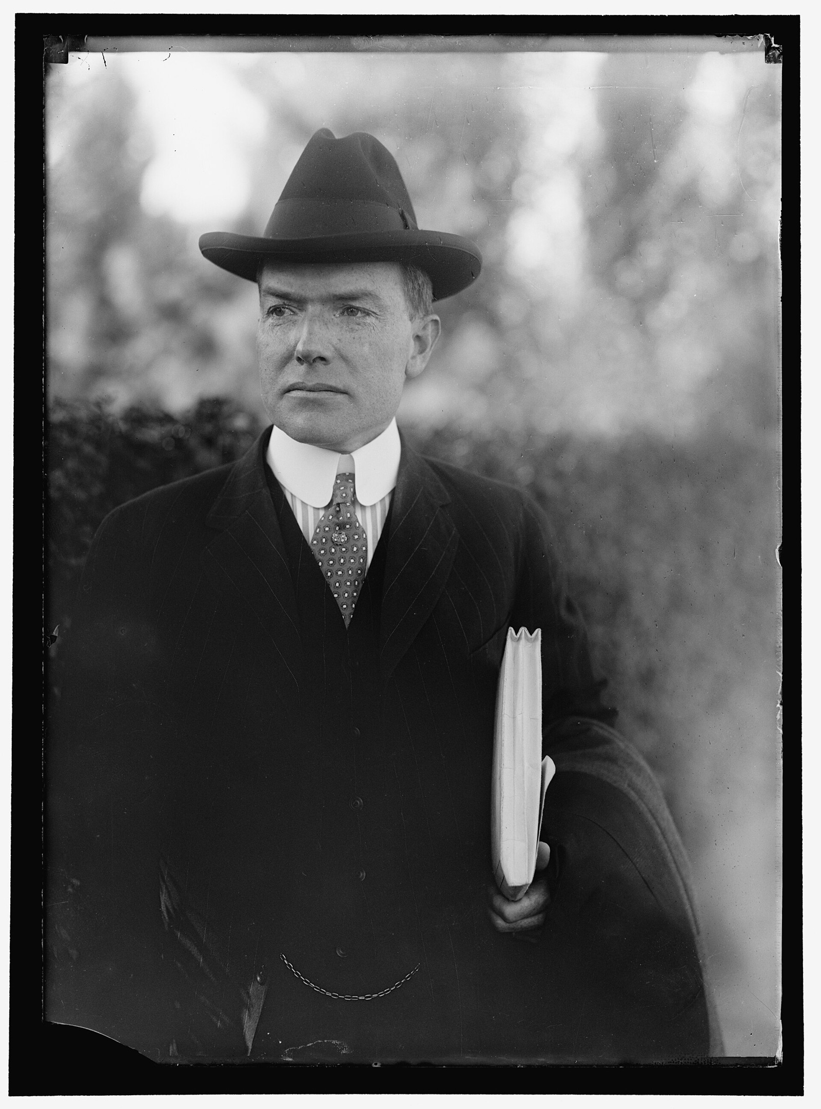 John D. Rockefeller Jr. in a dark suit, a 1917 studio portrait.