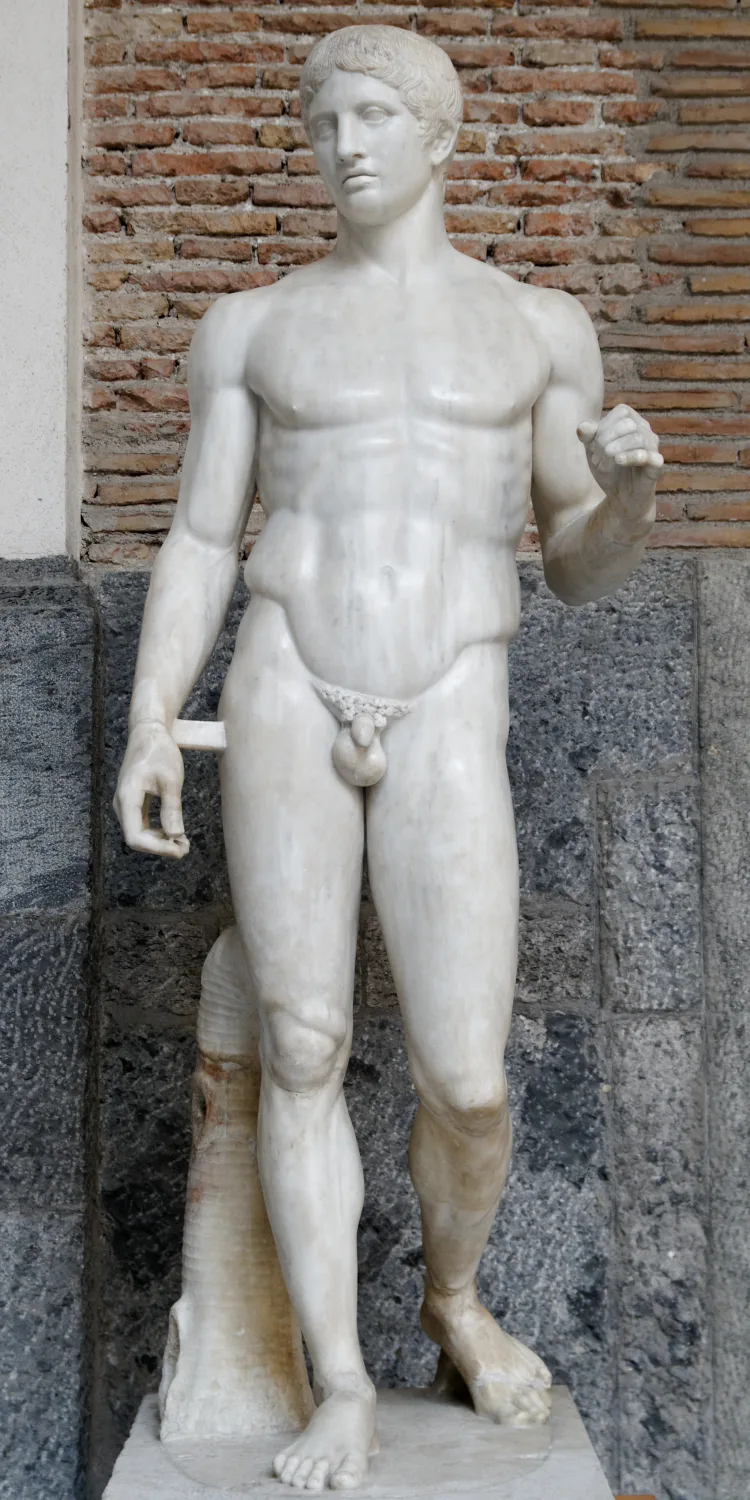 The Doryphoros, a classical marble statue of an idealized, evenly muscled young man standing in a relaxed contrapposto pose.