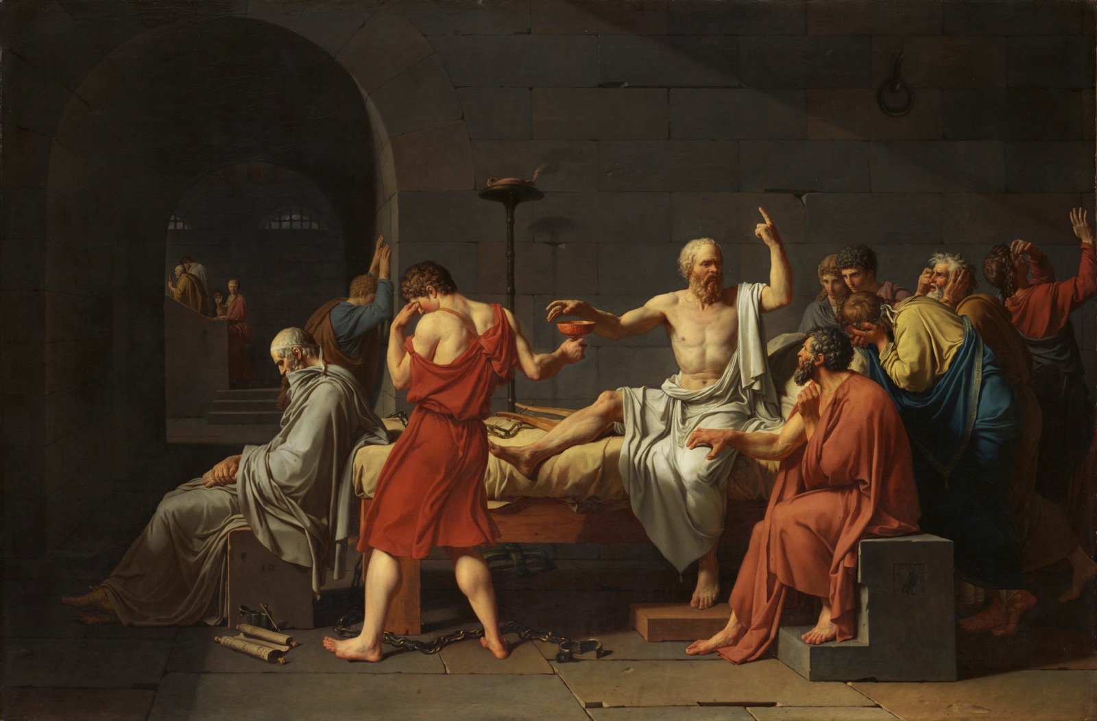 Jacques-Louis David's 1787 painting The Death of Socrates: Socrates sits upright on a prison bed, one hand reaching for the cup of poison, the other raised with a finger pointing up as he keeps teaching, while grieving disciples surround him and a figure sits slumped at the foot of the bed.