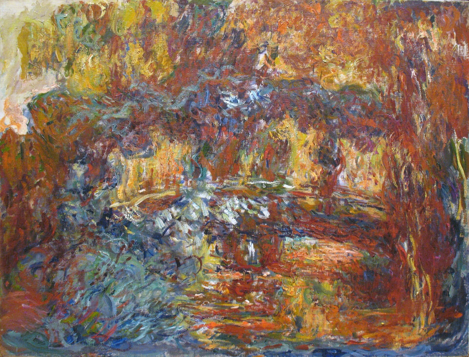 Monet's late painting of the Japanese footbridge over his lily pond, dissolved into thick swirls of maroon, rust, and orange, with almost no blue or green left.