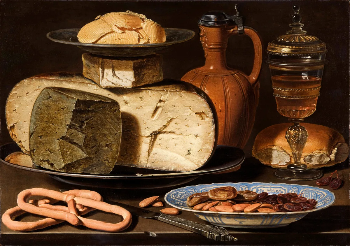 Clara Peeters's around-1615 still life: stacked cheeses, a dish of almonds, pretzels, butter, dried figs and a tall glass on a wooden table.