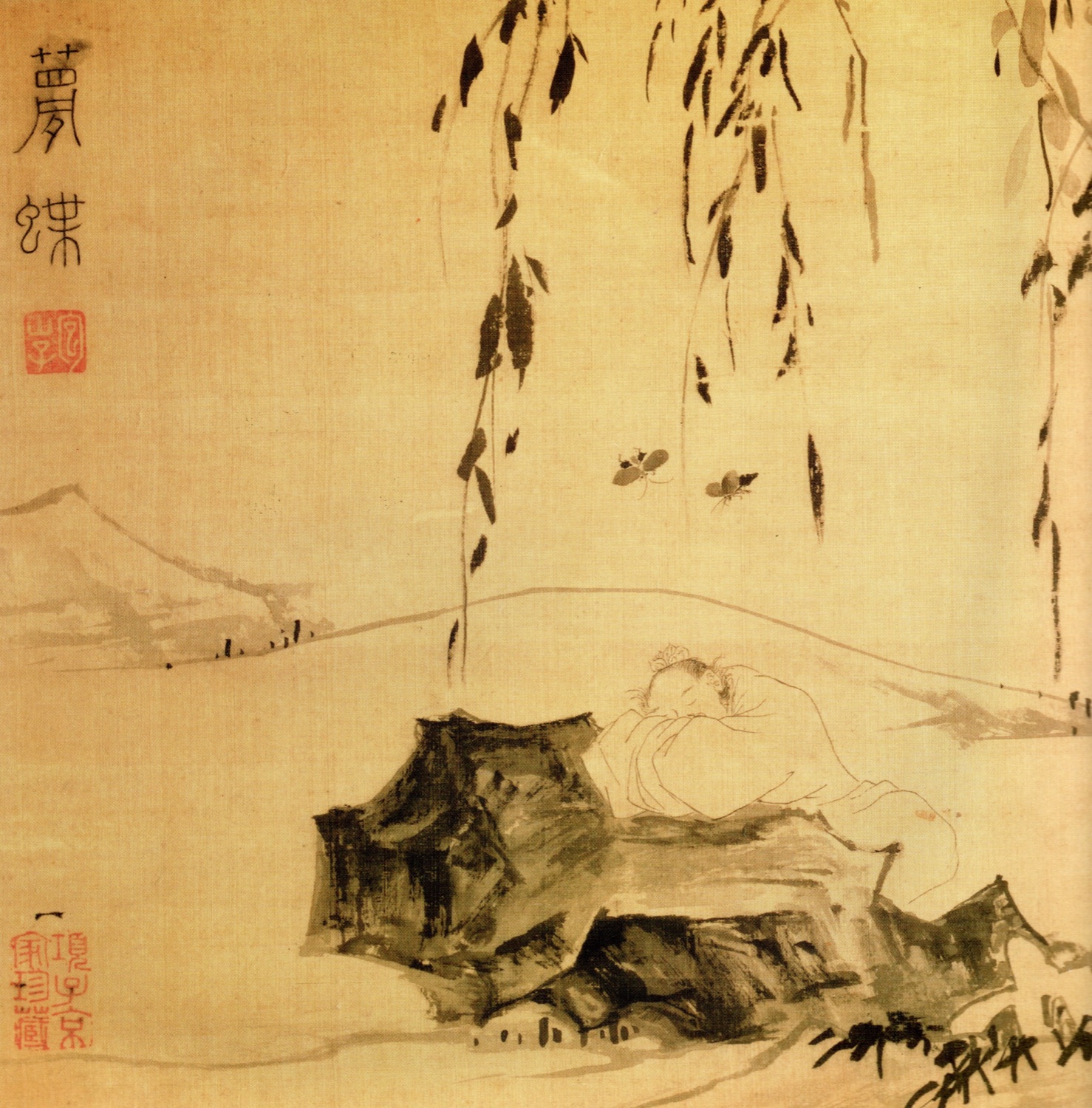 A Ming-dynasty ink painting on tan silk: a robed man sleeps on a rock by a low riverbank, head on his hand, while two butterflies flutter above him under a drooping willow, a distant mountain at left.