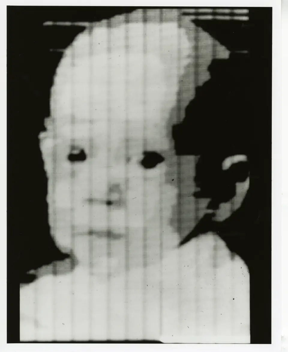 The first digital image, 1957: a coarse 176 by 176 pixel scan of a baby's face.