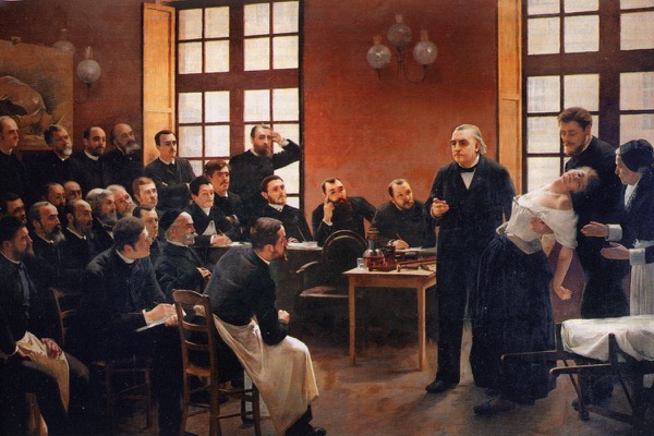 A 19th-century painting of the neurologist Charcot presenting a fainting woman to a room of attentive physicians at a Paris asylum. Andre Brouillet, A Clinical Lesson at the Salpetriere (1887).
