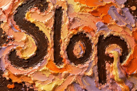 The word Slop scraped through thick orange, peach and lilac paint.